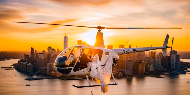 Wedding couple celebrating in a luxury helicopter over the NYC Skyline